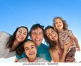 /album/fotogaleria/stock-photo-group-of-happy-smiling-friends-man-women-and-kids-having-fun-outdoors-against-blue-sky-background-94997839-jpg/
